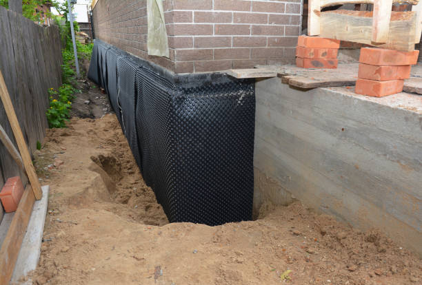 SJ Waterproofing Pros technician performing targeted Emergency Waterproofing assessment in Lynbrook, NY